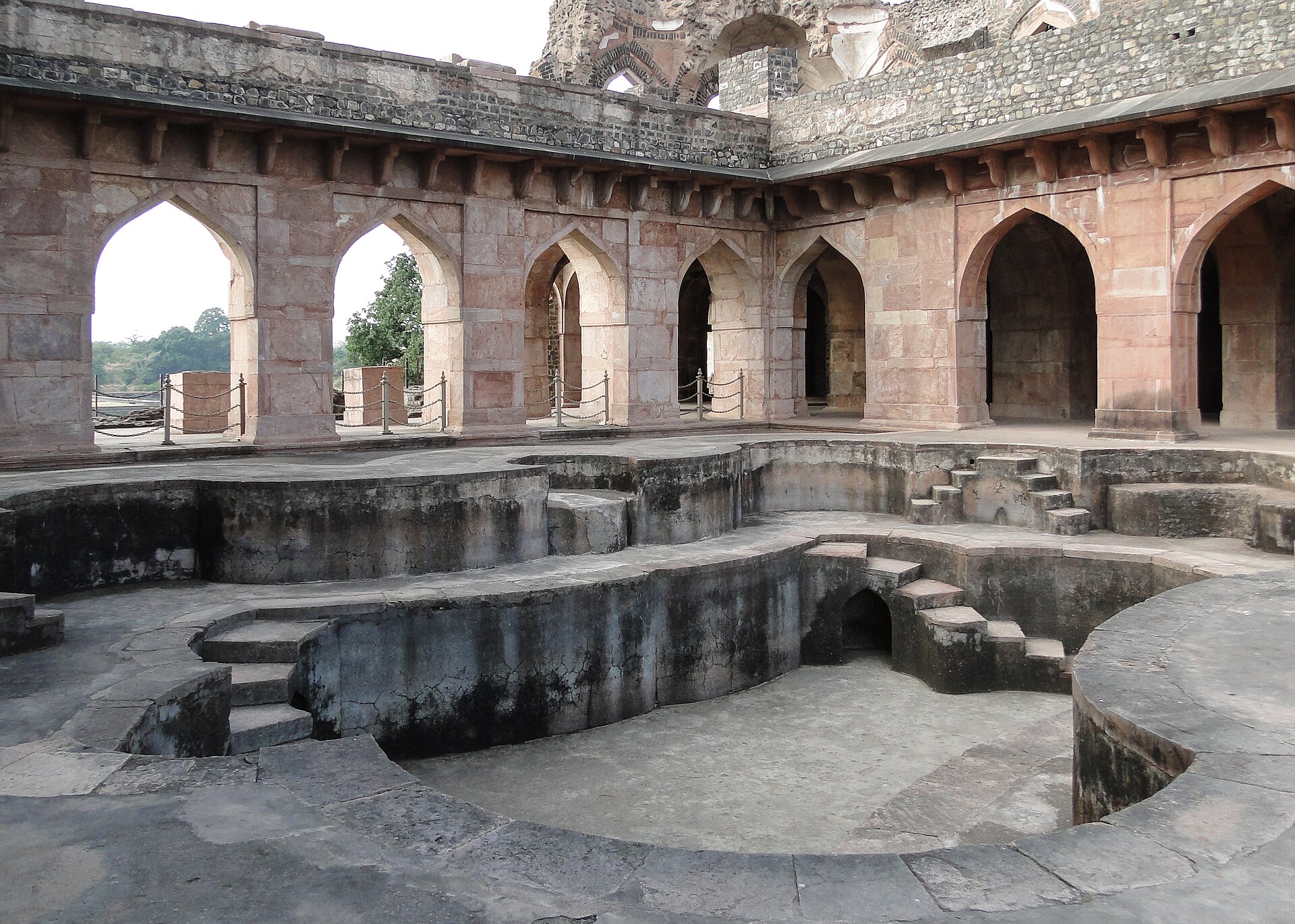 Jahaz Mahal at Mandu surrounded by monsoon greenery
